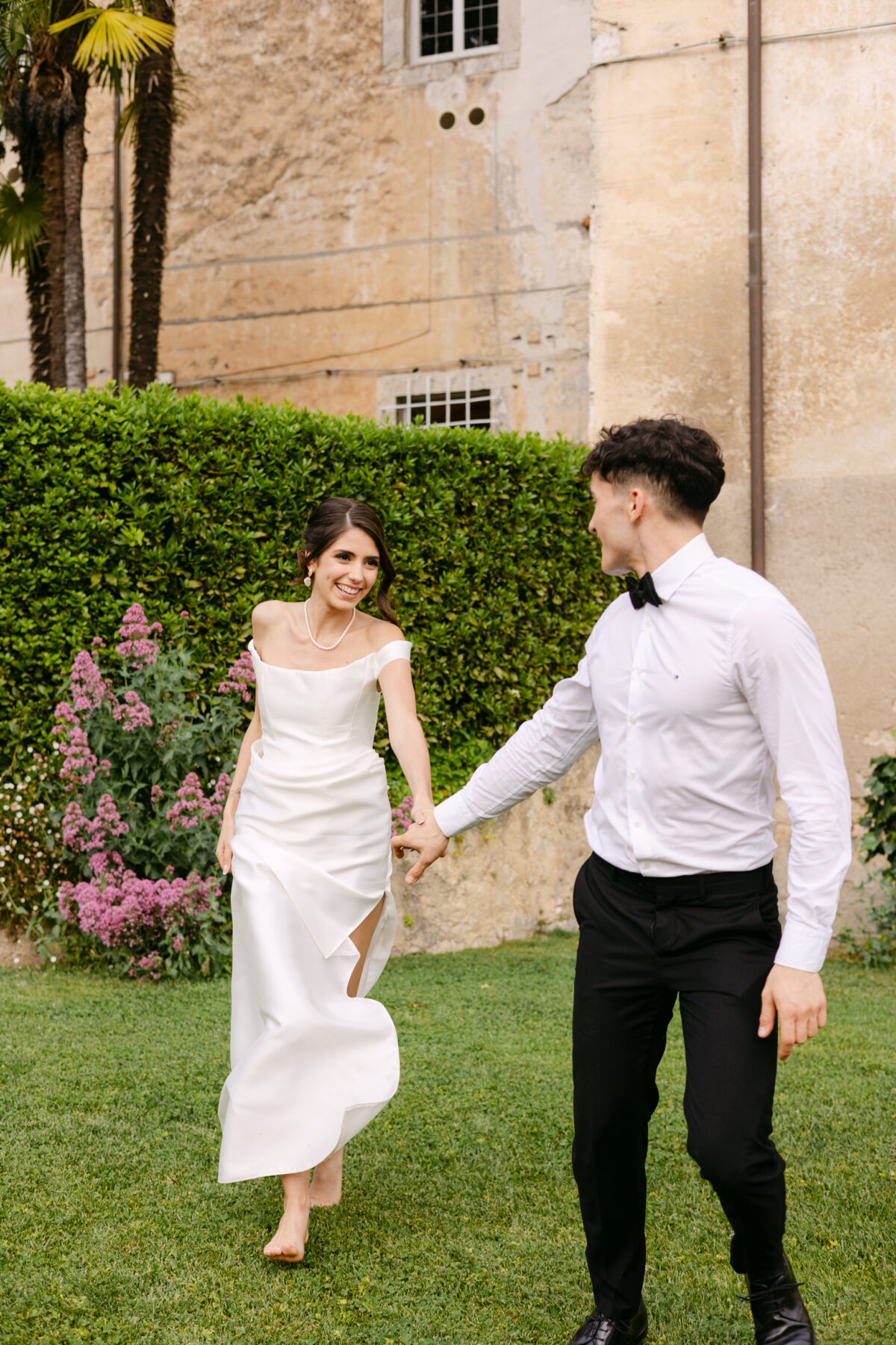 Luxury destination wedding in Italy with bride and groom in a historic villa garden, representing bespoke wedding planning in Paris, Biarritz, Italy and worldwide